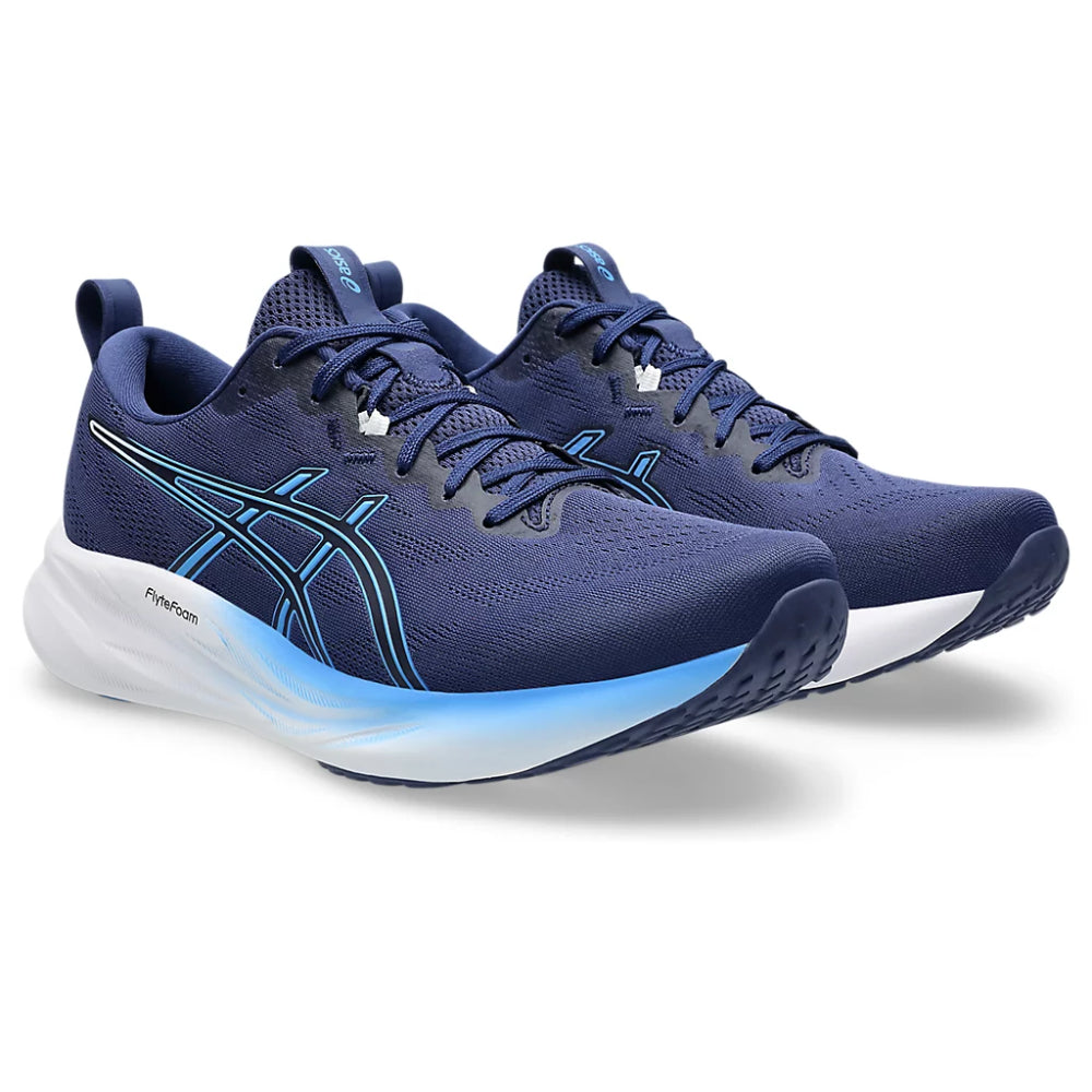 Blue running shoes with white sole on a white background